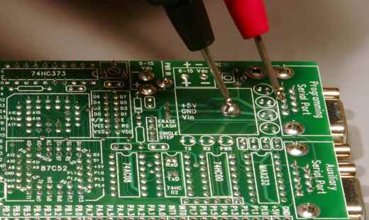 photo: multimeters leads on serial port pin 3 and ground